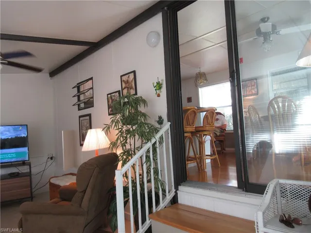 a view of a livingroom with furniture and staircase