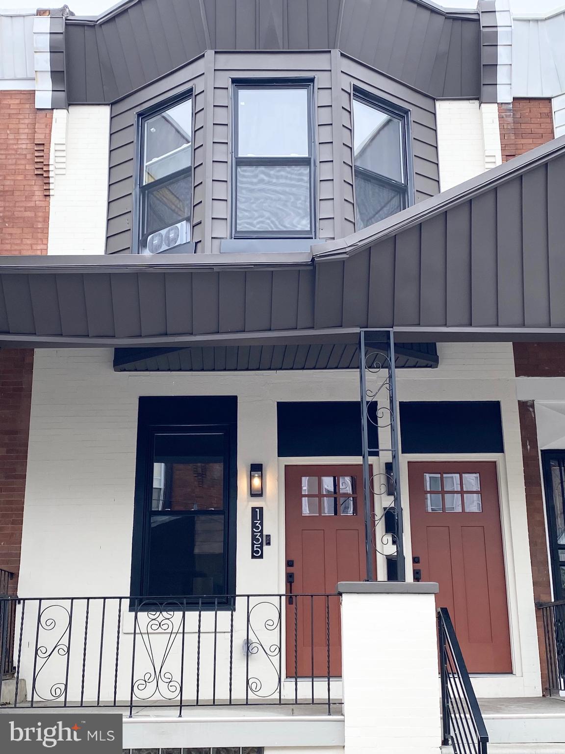 1335 Colwyn Street, Unit 1 Philadelphia, PA 19140 - Photo 1 of 1 a front view of a house with a glass door
