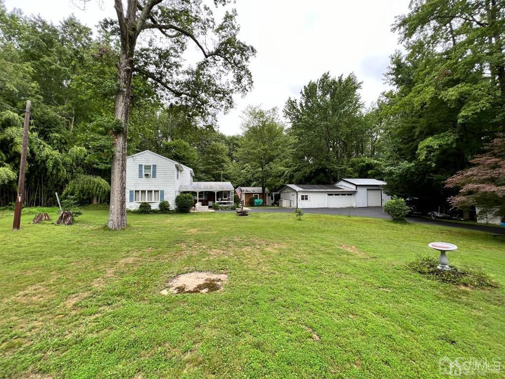 21 White Pine Road North Brunswick, NJ 08902 - Photo 2 of 33 a front view of a house with garden