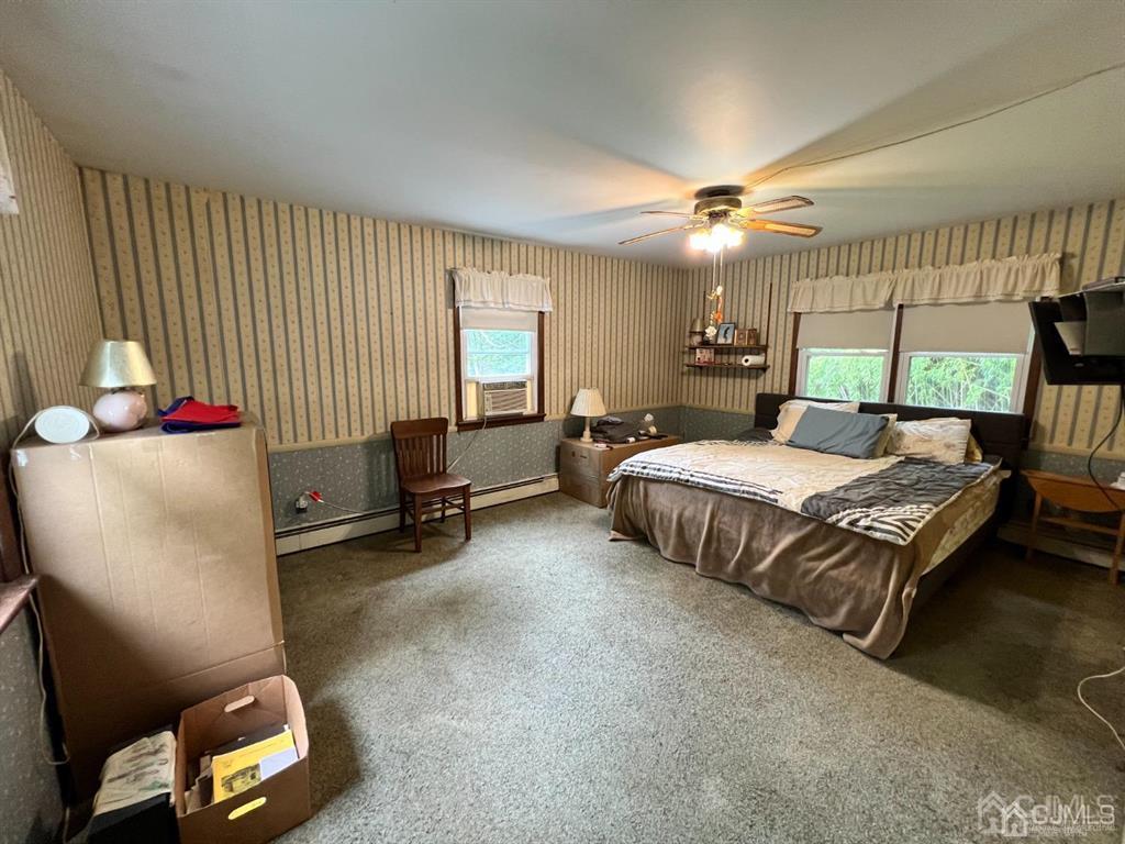 21 White Pine Road North Brunswick, NJ 08902 - Photo 25 of 33 a bedroom with a bed and a chandelier