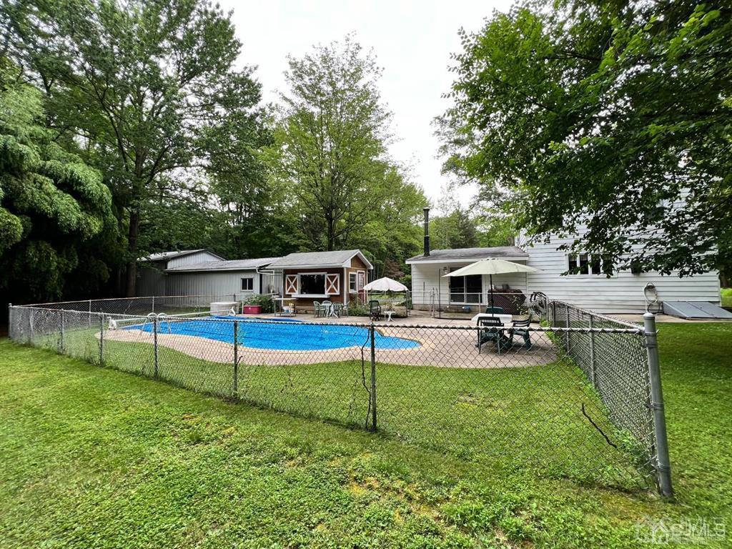 21 White Pine Road North Brunswick, NJ 08902 - Photo 29 of 33 a view of a house with swimming pool and sitting area