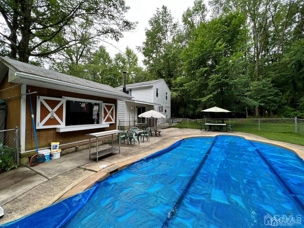 21 White Pine Road North Brunswick, NJ 08902 - Photo 30 of 33 a view of backyard with swimming pool and furniture