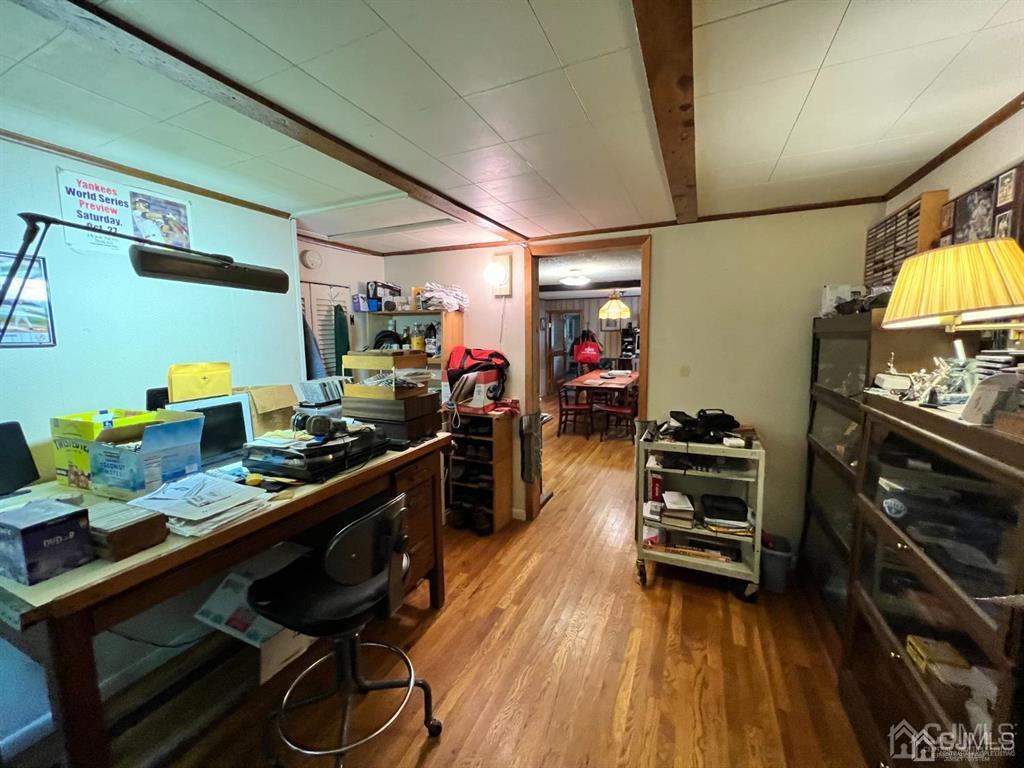 21 White Pine Road North Brunswick, NJ 08902 - Photo 7 of 33 a kitchen with stainless steel appliances a stove a sink dishwasher and cabinets with wooden floor