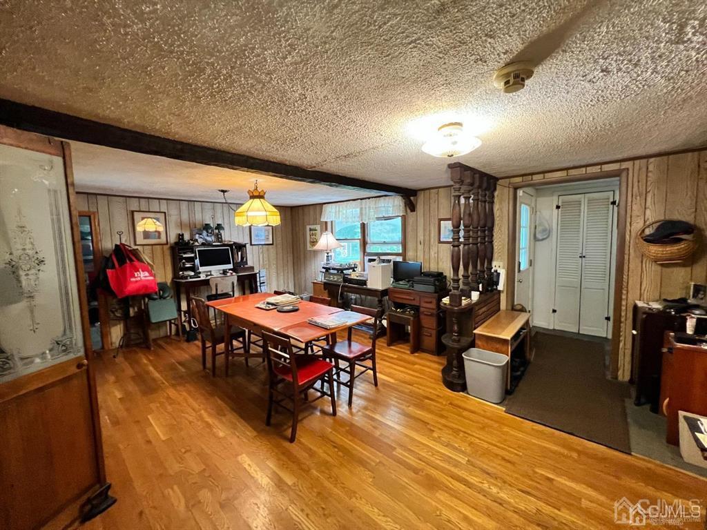 21 White Pine Road North Brunswick, NJ 08902 - Photo 8 of 33 a living room with furniture a rug kitchen view and a large window