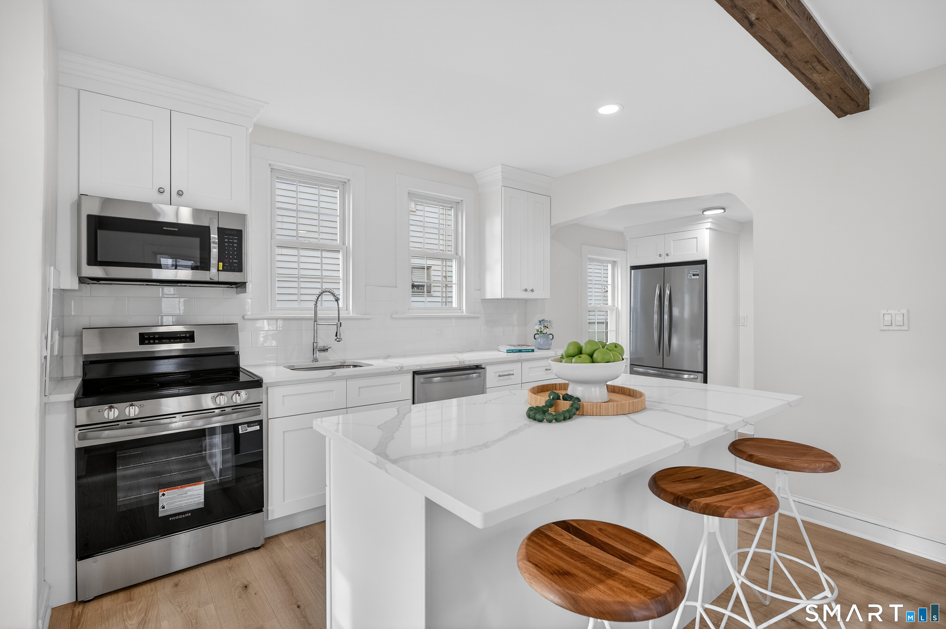 190 West Main Street Milford, CT 06460 - Photo 11 of 28 a kitchen with stainless steel appliances a stove a sink and a microwave