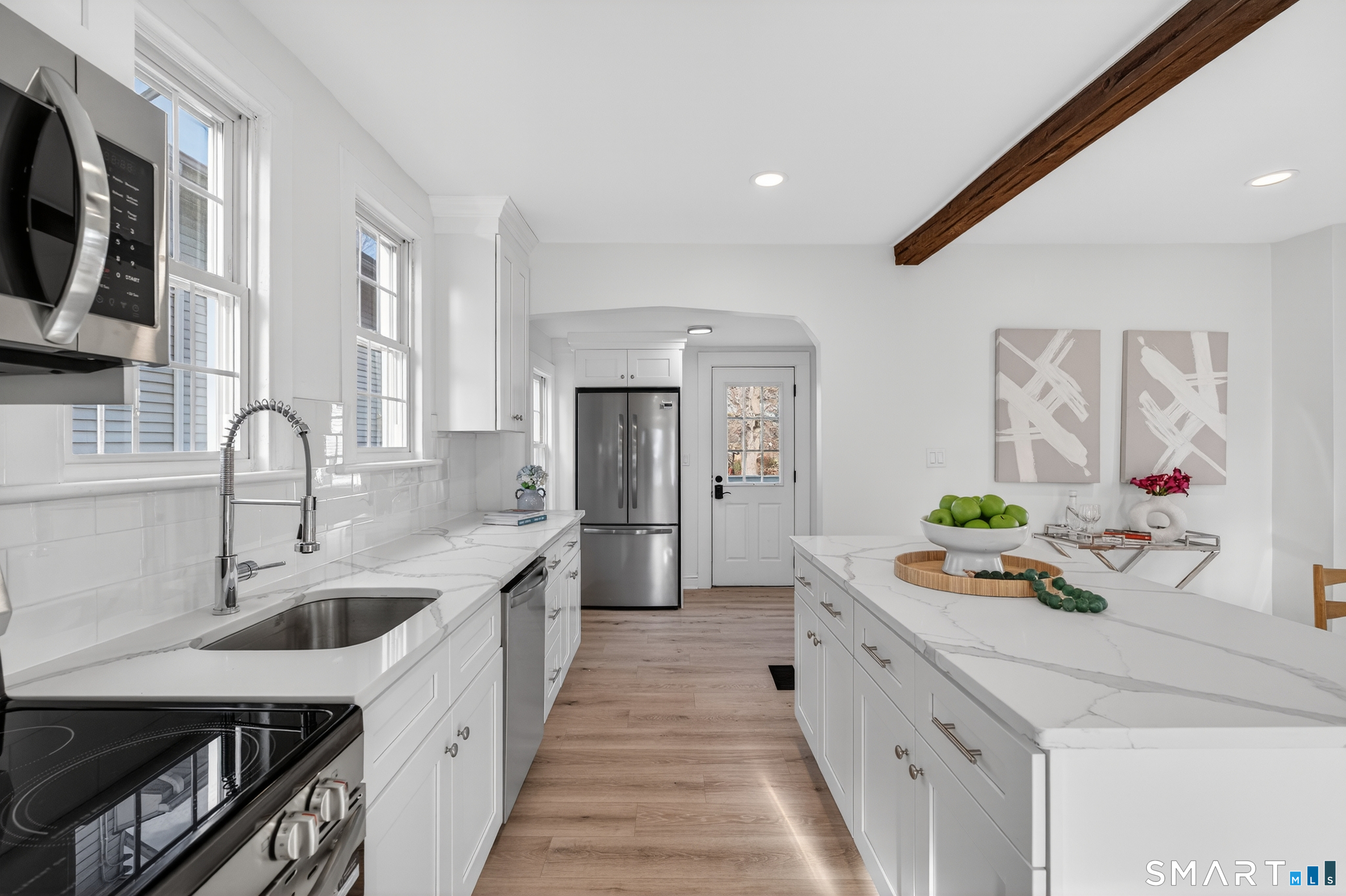190 West Main Street Milford, CT 06460 - Photo 12 of 28 a kitchen with stainless steel appliances granite countertop a sink stove and refrigerator
