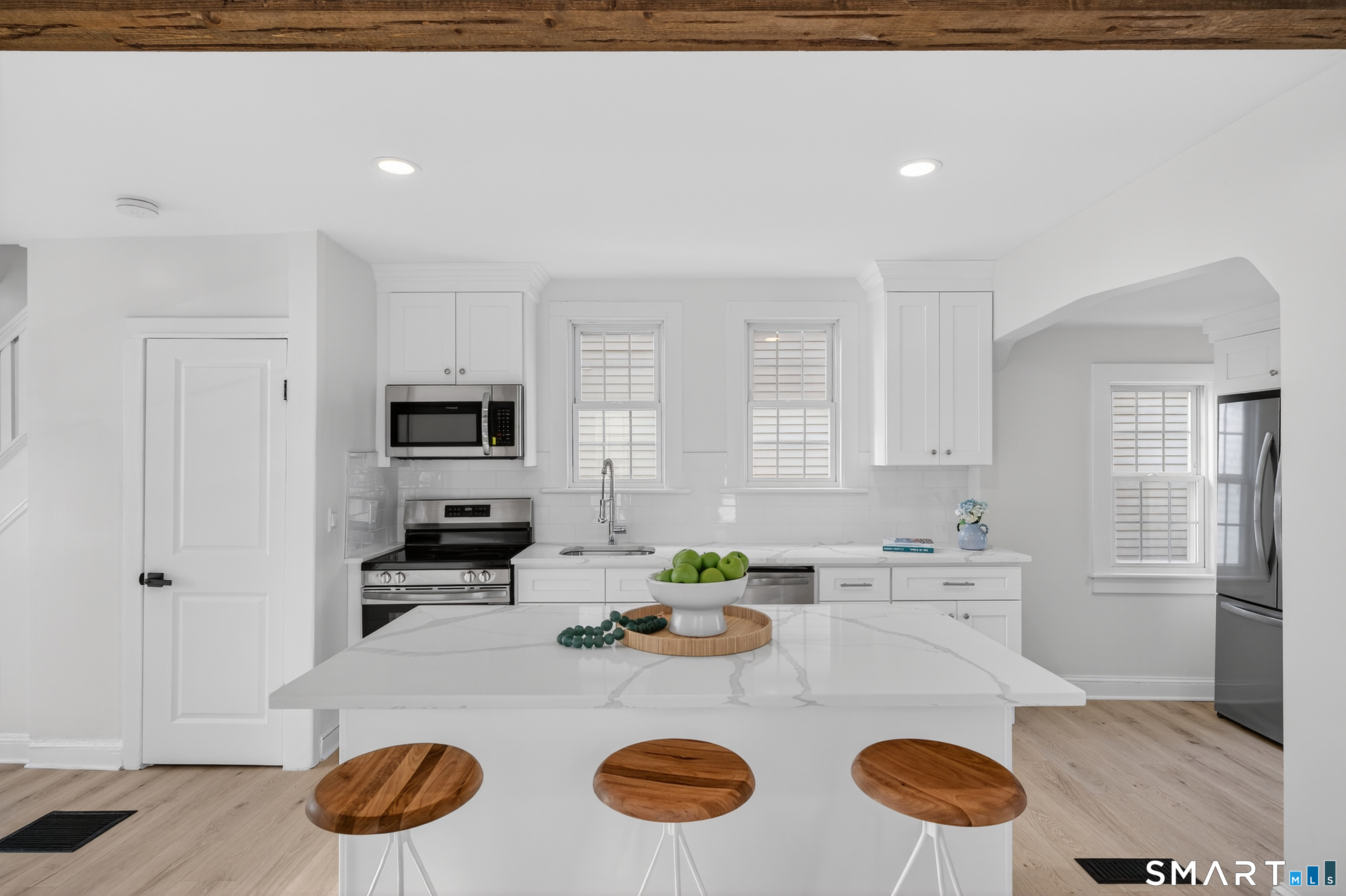 190 West Main Street Milford, CT 06460 - Photo 14 of 28 a kitchen with stainless steel appliances granite countertop a stove a refrigerator a sink dishwasher with a dining table and chairs