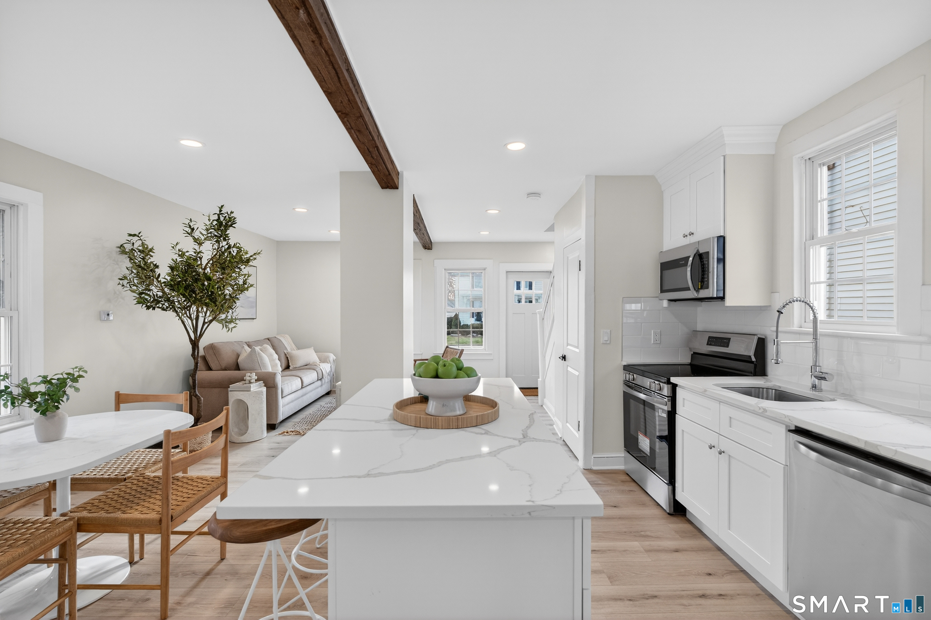 190 West Main Street Milford, CT 06460 - Photo 15 of 28 a kitchen with a sink potted plant and windows