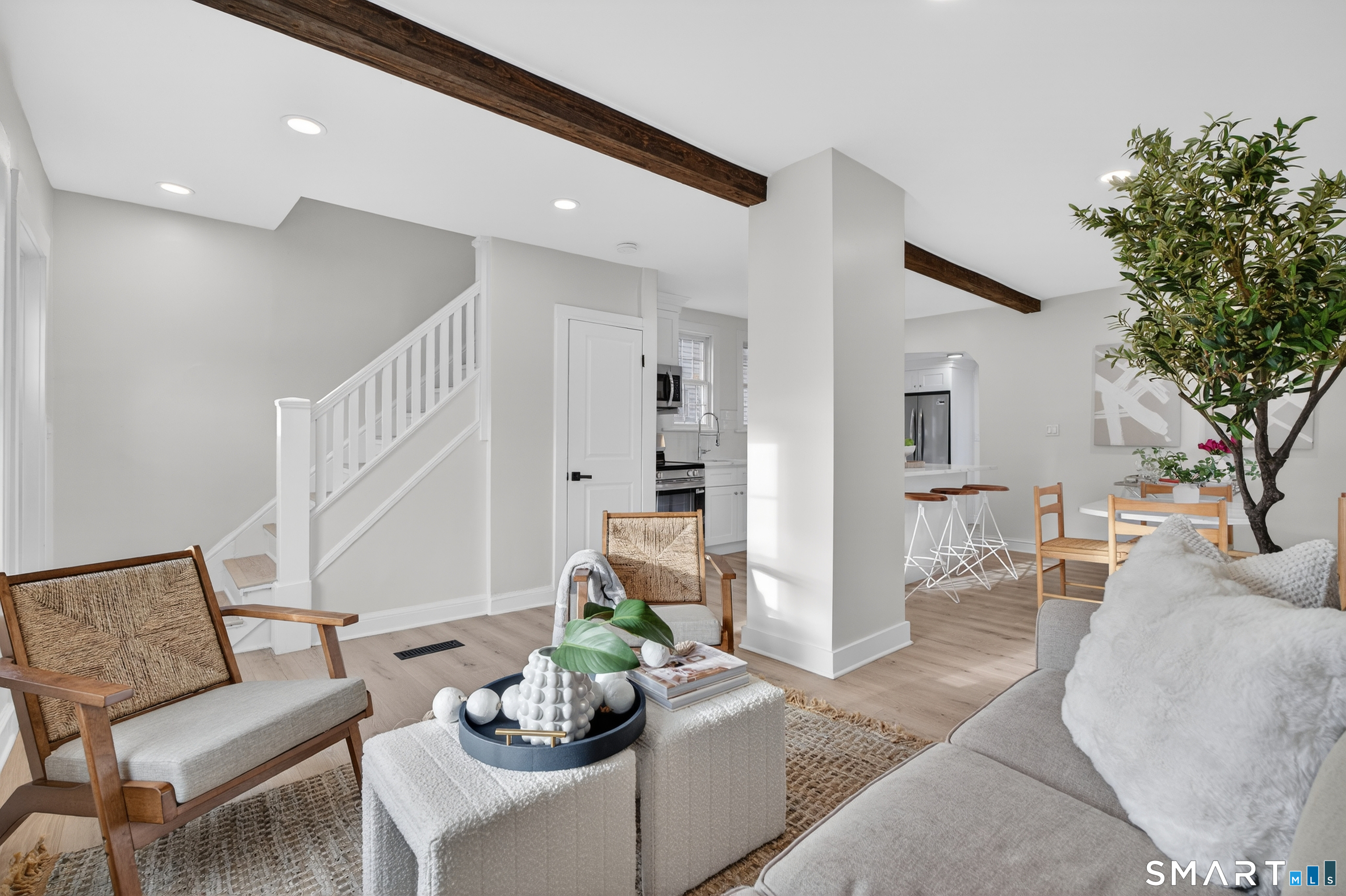 190 West Main Street Milford, CT 06460 - Photo 6 of 28 a living room with furniture and a potted plant