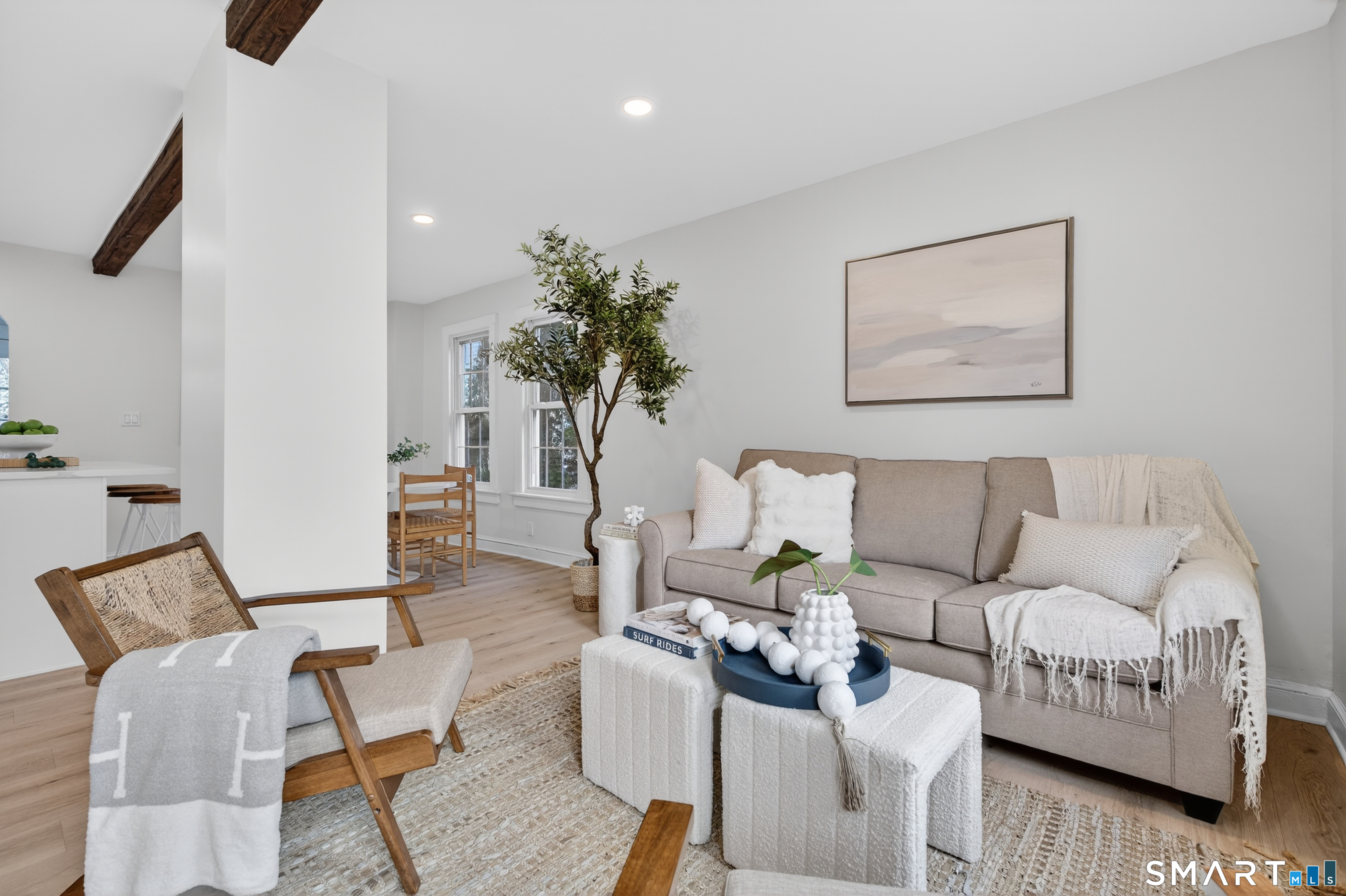190 West Main Street Milford, CT 06460 - Photo 8 of 28 a living room with furniture and a potted plant