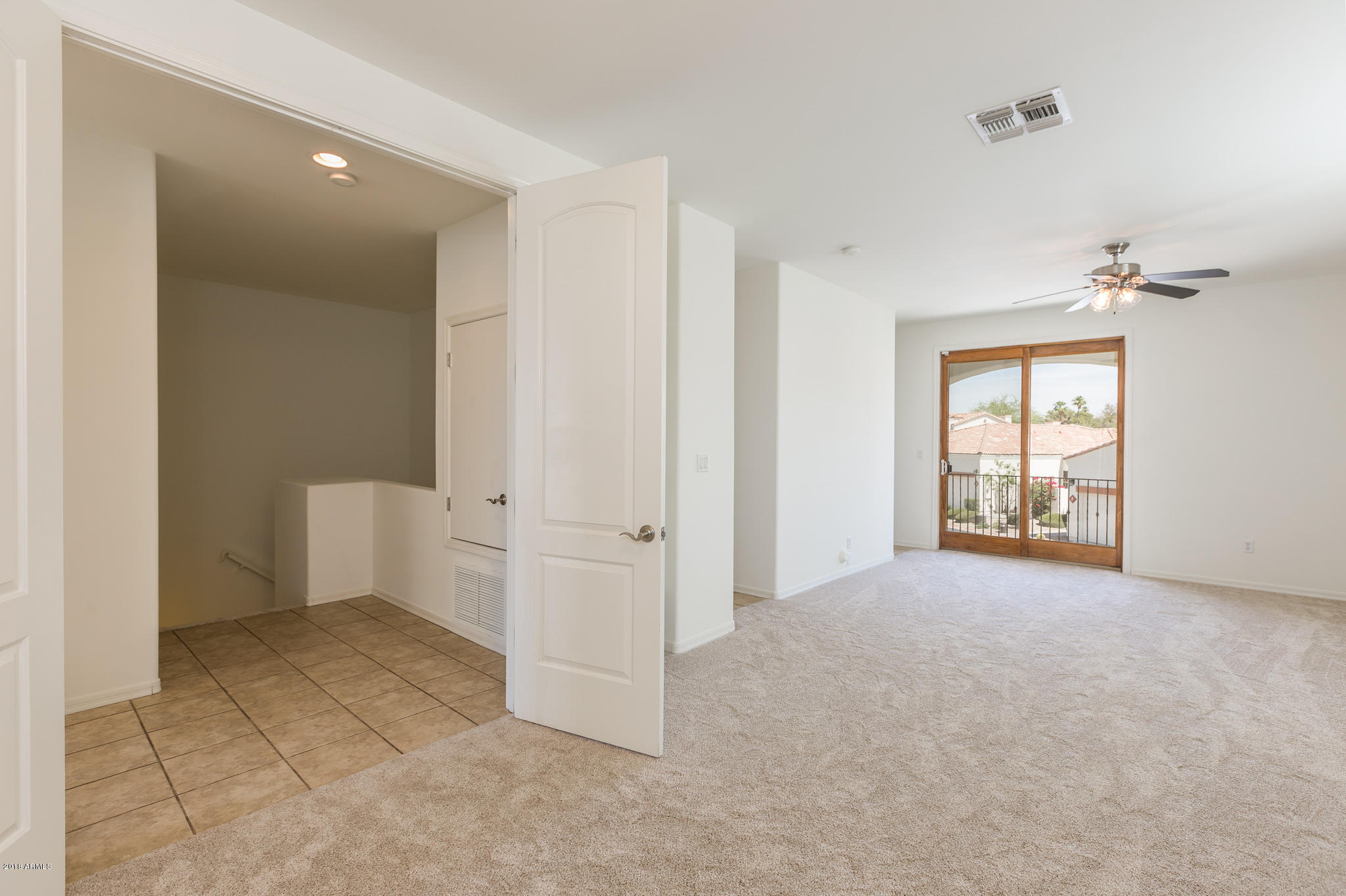 1750 East Ocotillo Road, Unit 23 Phoenix, AZ 85016 - Photo 11 of 27 an empty room with windows and closet