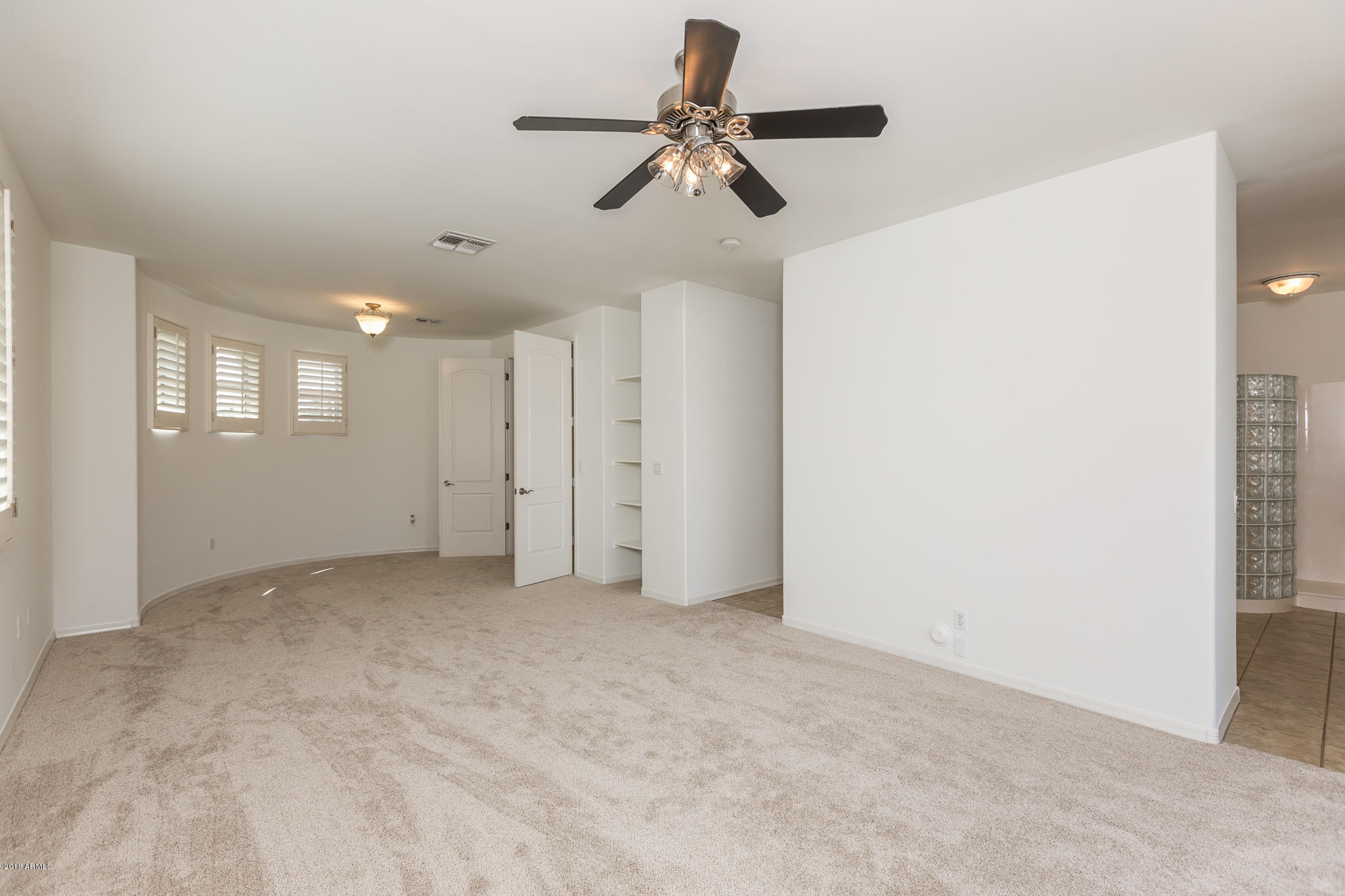 1750 East Ocotillo Road, Unit 23 Phoenix, AZ 85016 - Photo 12 of 27 a view of an empty room with a ceiling fan