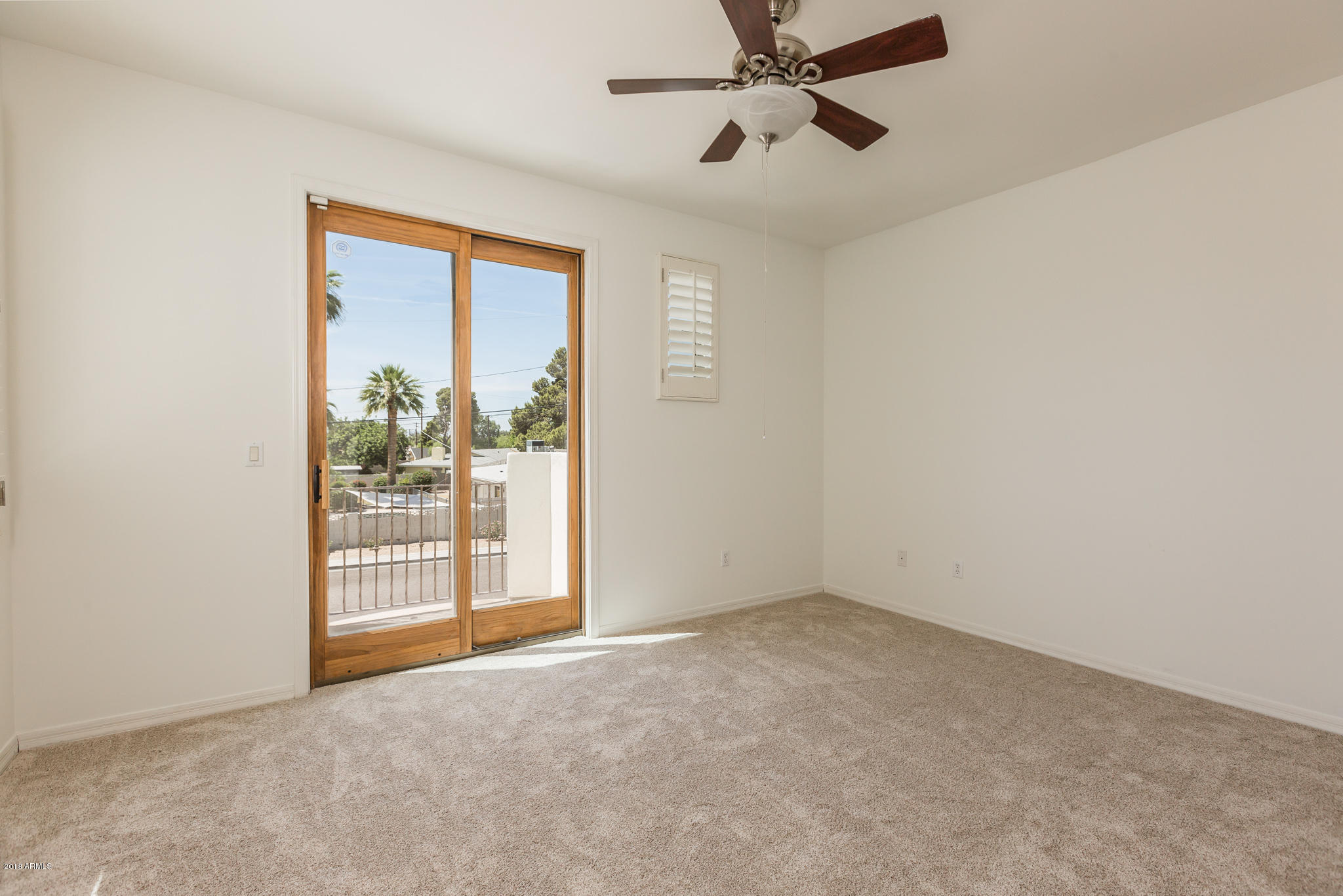 1750 East Ocotillo Road, Unit 23 Phoenix, AZ 85016 - Photo 16 of 27 an empty room with windows
