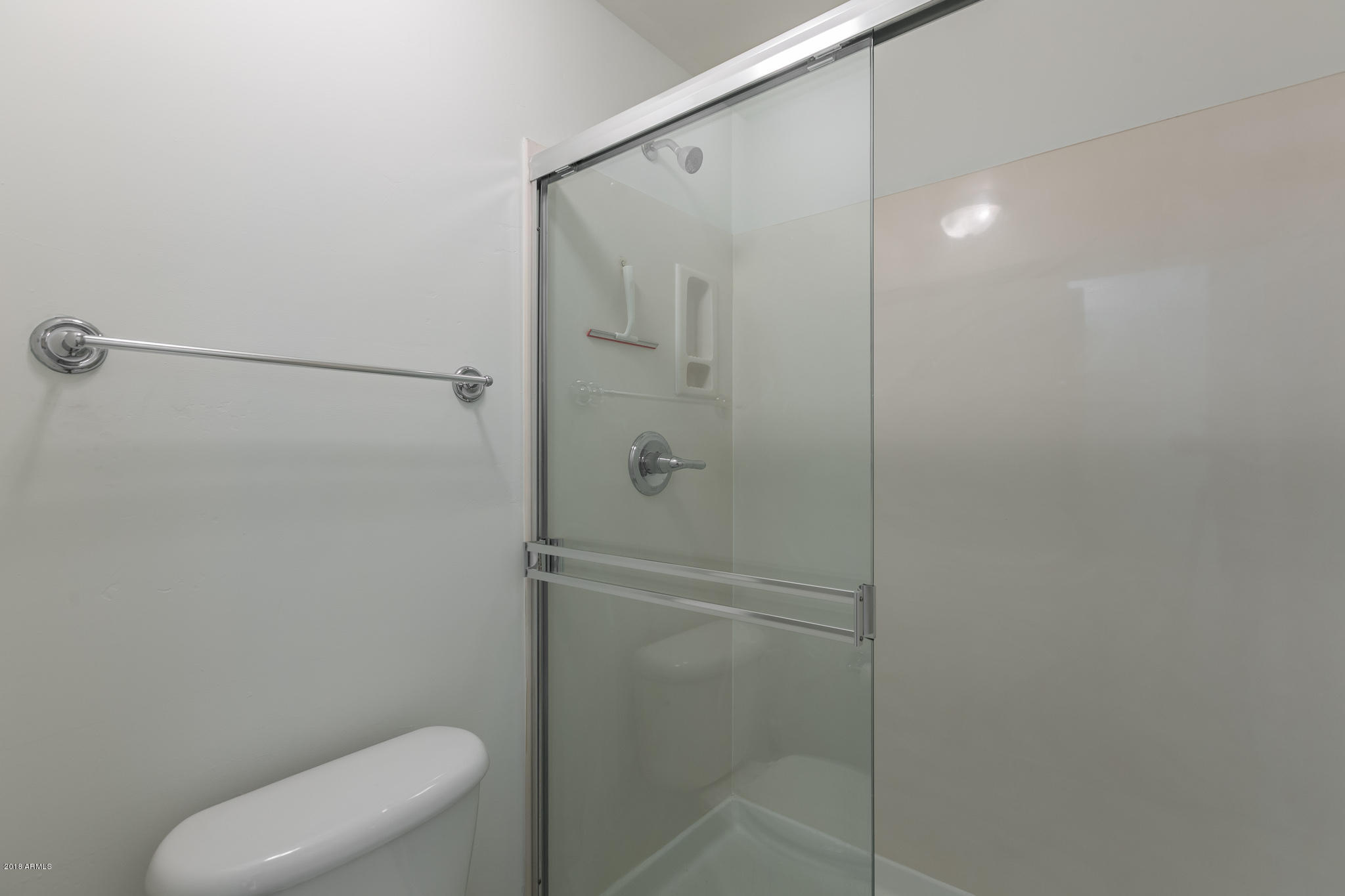 1750 East Ocotillo Road, Unit 23 Phoenix, AZ 85016 - Photo 19 of 27 a bathroom with a shower and toilet