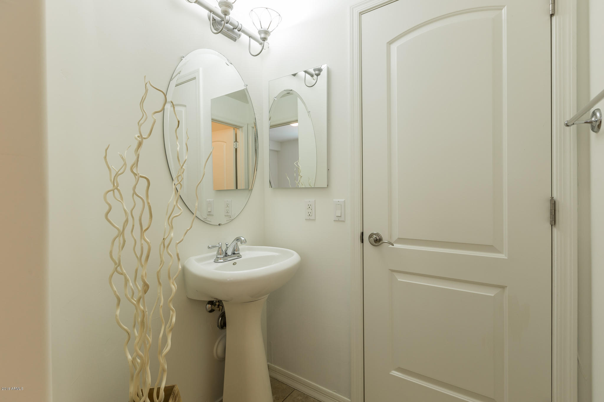 1750 East Ocotillo Road, Unit 23 Phoenix, AZ 85016 - Photo 20 of 27 a bathroom with a sink a mirror and a shower