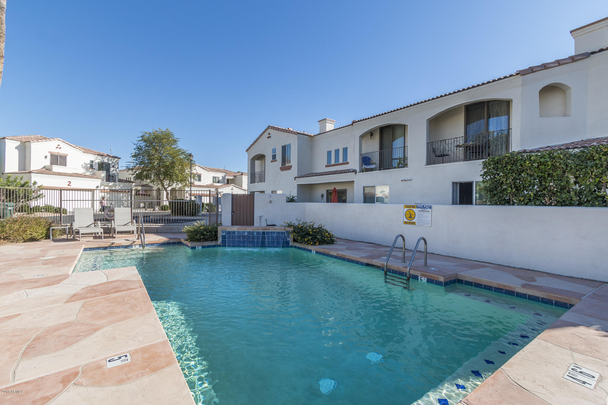 1750 East Ocotillo Road, Unit 23 Phoenix, AZ 85016 - Photo 25 of 27 a front view of a house with a garden