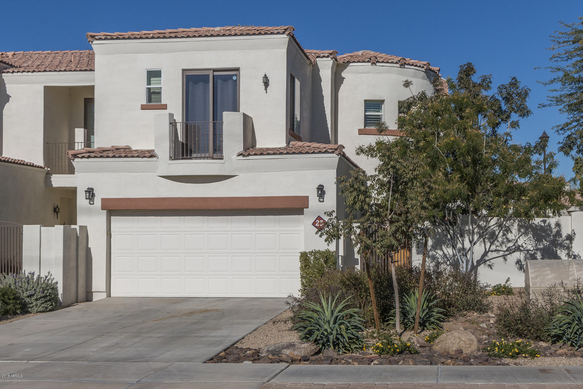 1750 East Ocotillo Road, Unit 23 Phoenix, AZ 85016 - Photo 27 of 27 a front view of a house with a yard garage and outdoor seating