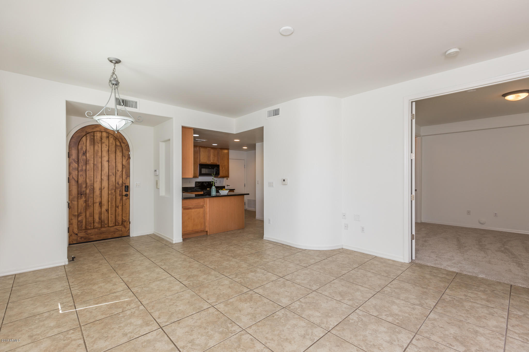 1750 East Ocotillo Road, Unit 23 Phoenix, AZ 85016 - Photo 4 of 27 a view of a kitchen with refrigerator and window