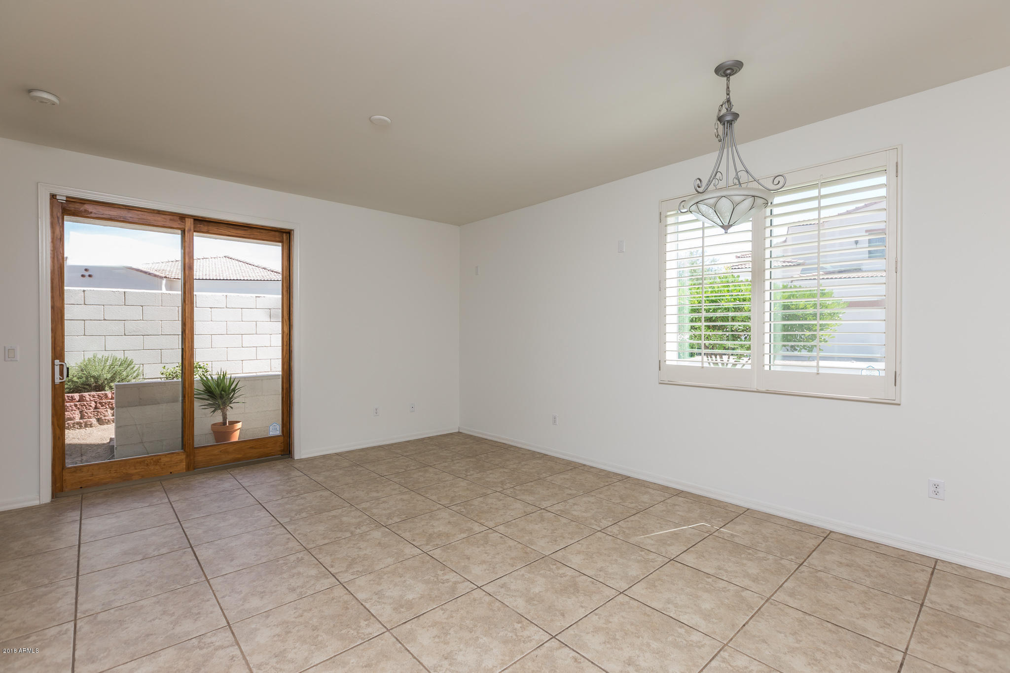 1750 East Ocotillo Road, Unit 23 Phoenix, AZ 85016 - Photo 6 of 27 a view of an empty room with window