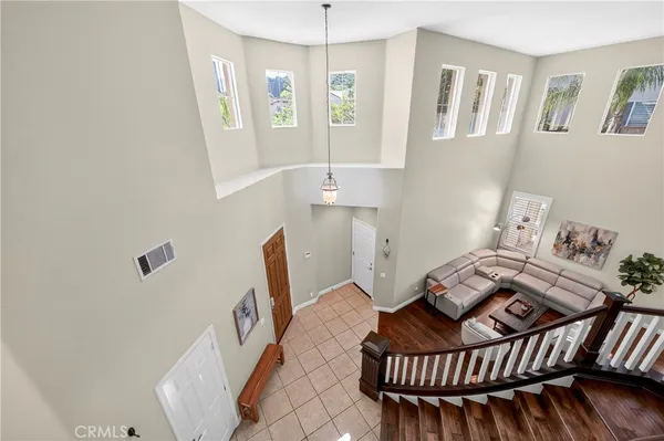 a bedroom with a bed ceiling fan and a window