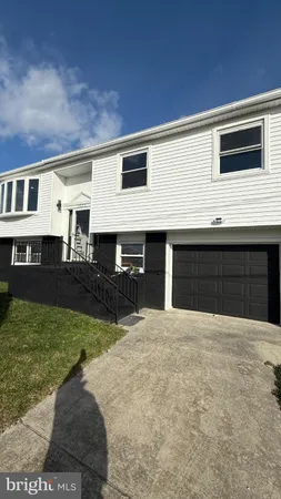 a front view of a house with yard