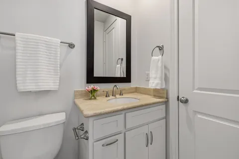 a view of a patio with couches chairs and a potted plant