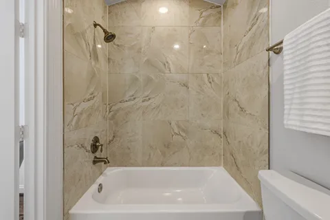 a picture of a bathroom with a shower