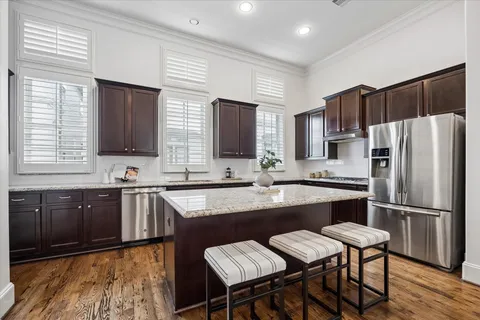 an aerial view of multi story residential apartment building with entryway