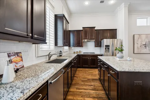an aerial view of a house with a yard