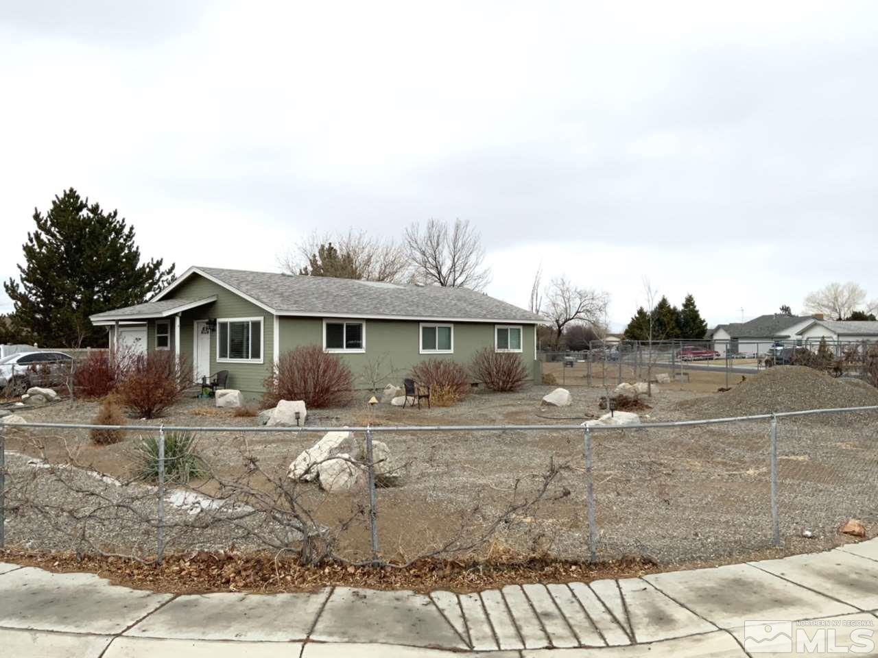 282 River Boat Road Dayton, NV 89403 - Photo 1 of 15 a front view of a house with a yard