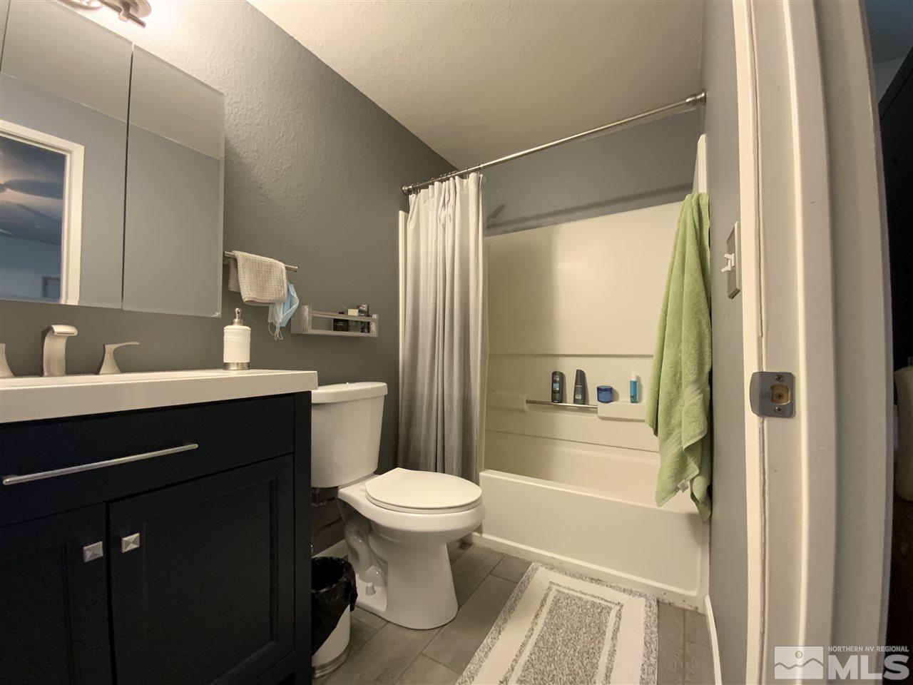 282 River Boat Road Dayton, NV 89403 - Photo 15 of 15 a bathroom with a sink toilet and shower