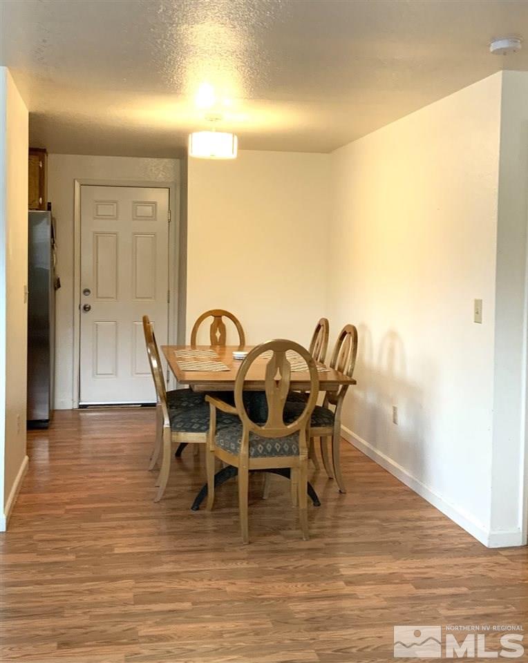 282 River Boat Road Dayton, NV 89403 - Photo 7 of 15 a view of a dining room with furniture and wooden floor