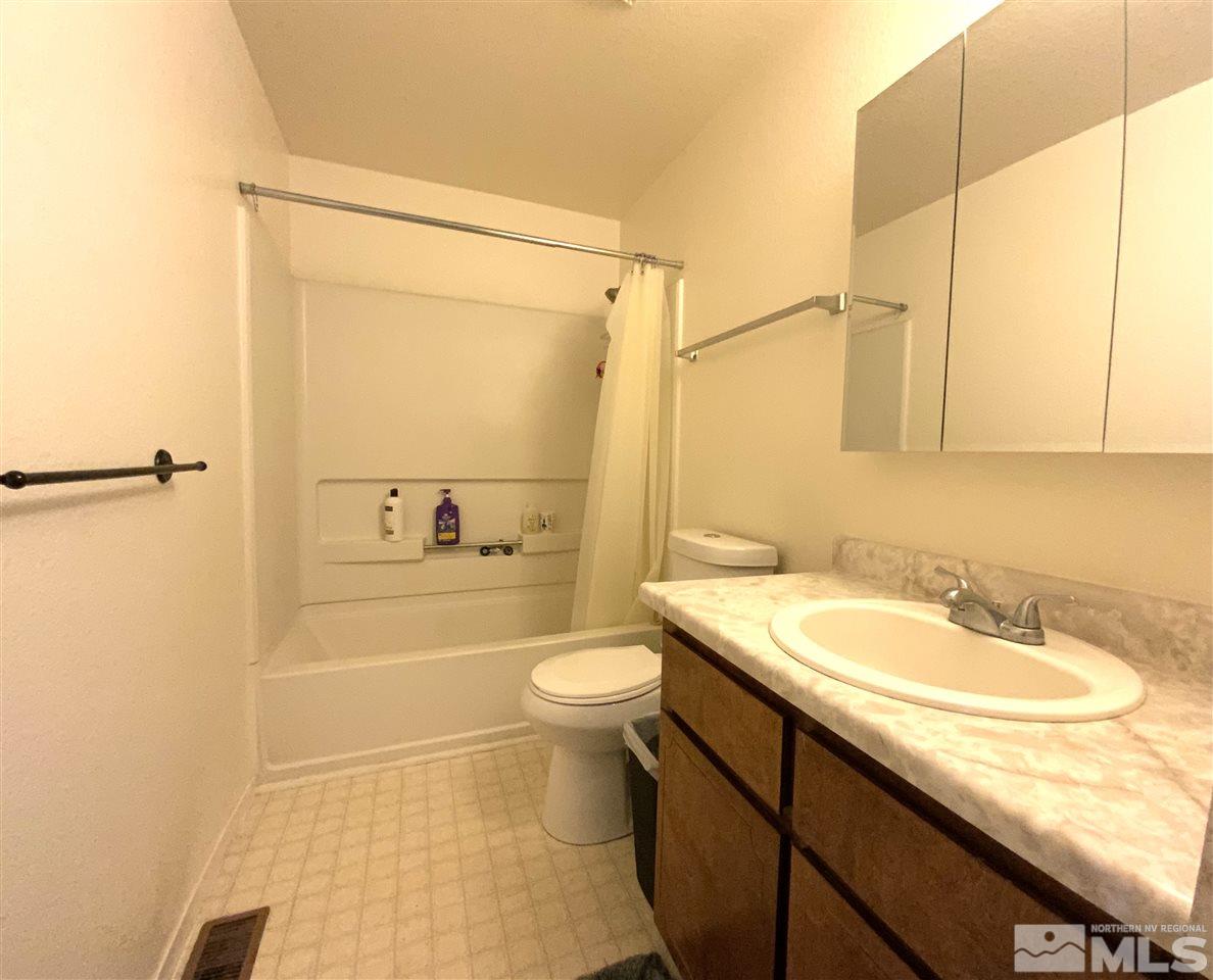 282 River Boat Road Dayton, NV 89403 - Photo 9 of 15 a bathroom with a sink a toilet and shower