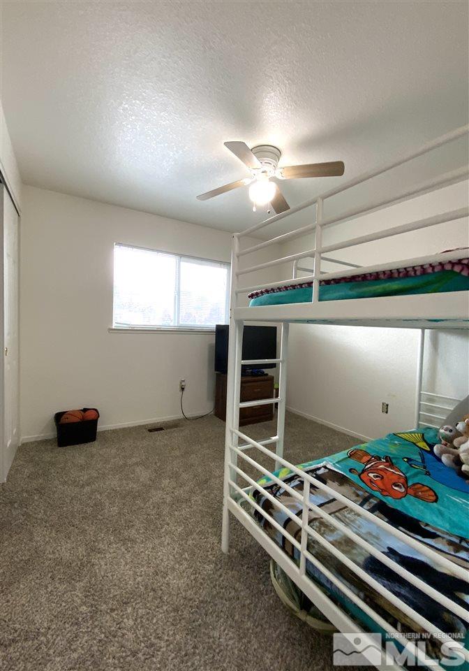 282 River Boat Road Dayton, NV 89403 - Photo 10 of 15 a room with gym equipment and windows