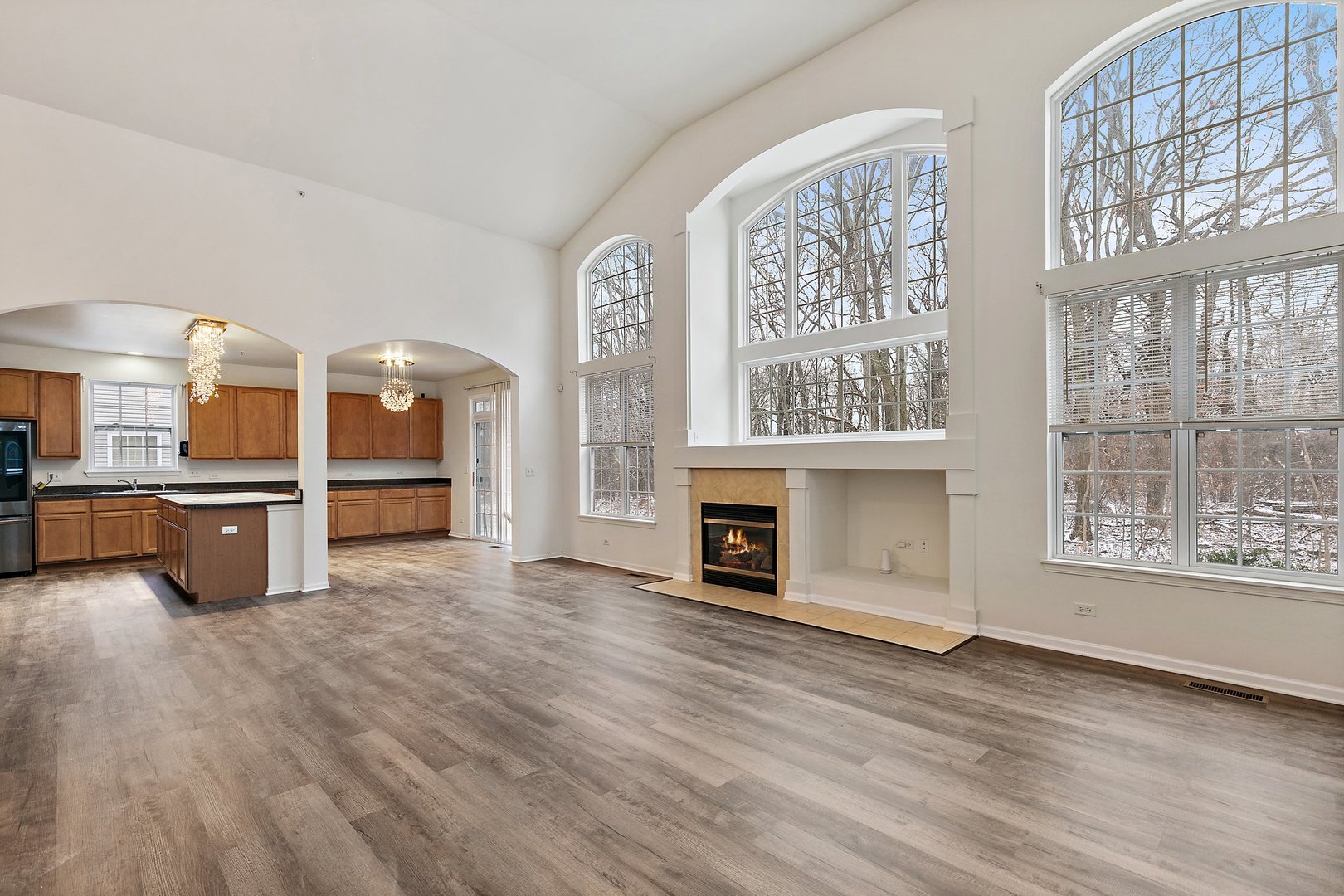 5734 Red Oak Drive Hoffman Estates, IL 60192 - Photo 12 of 31 a view of a living room kitchen with furniture and a fireplace