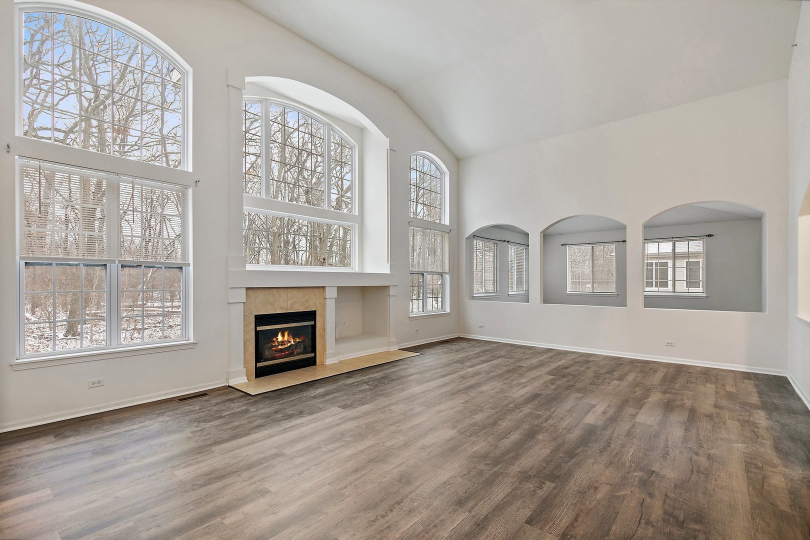 5734 Red Oak Drive Hoffman Estates, IL 60192 - Photo 14 of 31 a view of livingroom with furniture wooden floor front door and windows