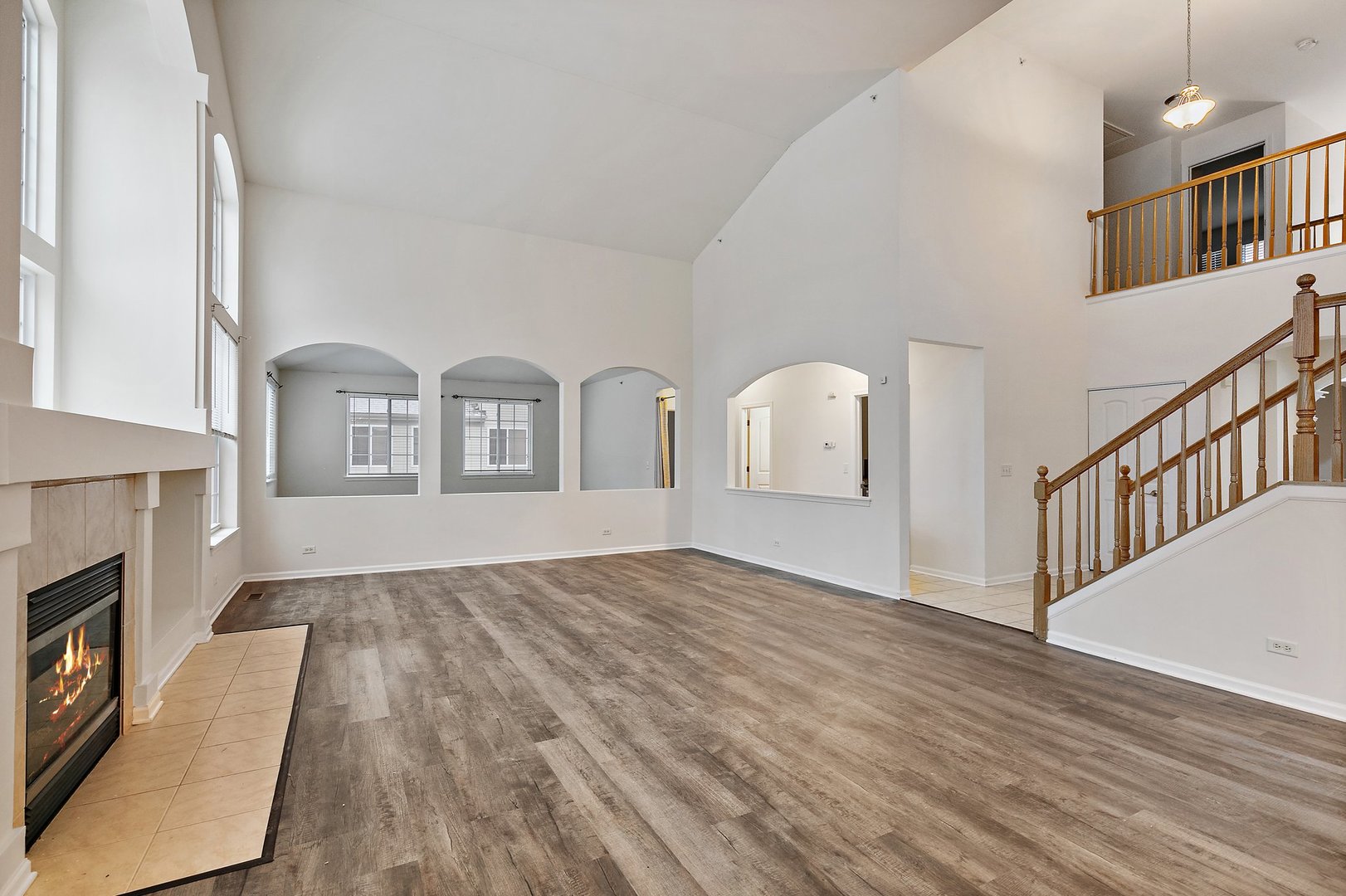 5734 Red Oak Drive Hoffman Estates, IL 60192 - Photo 15 of 31 a view of a livingroom with wooden floor and a fireplace