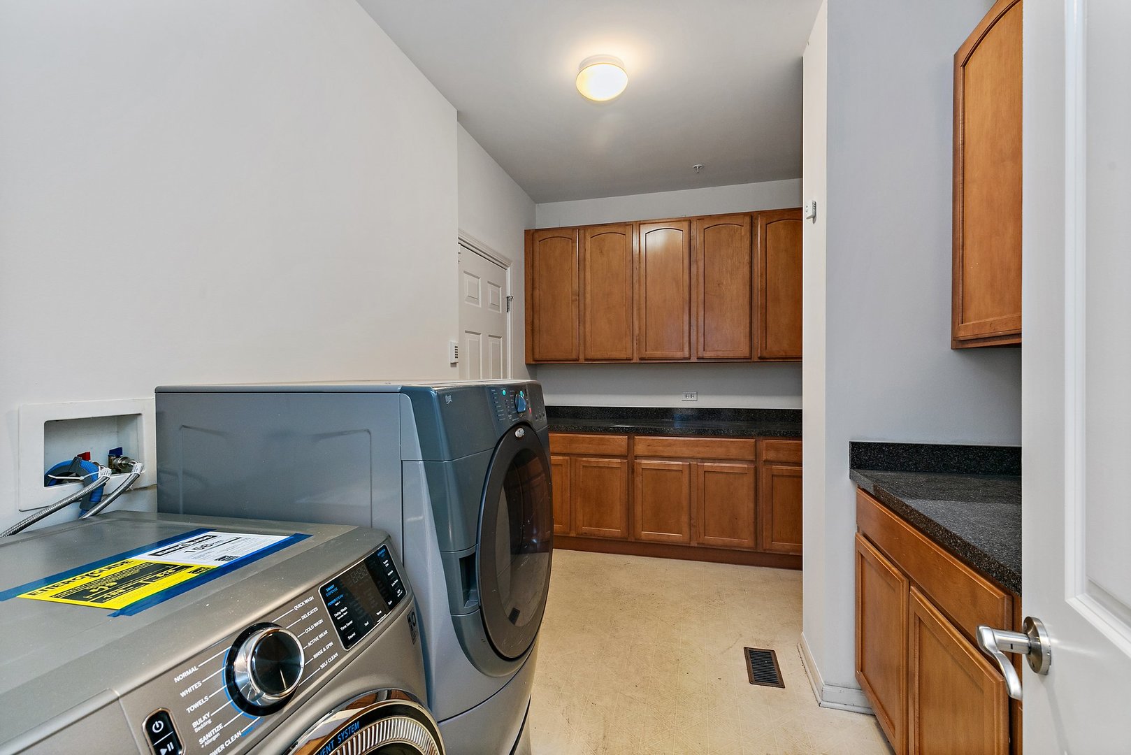 5734 Red Oak Drive Hoffman Estates, IL 60192 - Photo 19 of 31 a utility room with dryer and washer