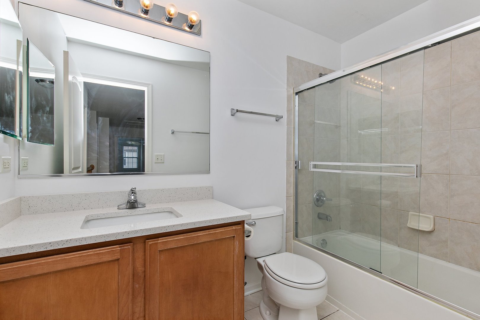 5734 Red Oak Drive Hoffman Estates, IL 60192 - Photo 23 of 31 a bathroom with a sink and a mirror