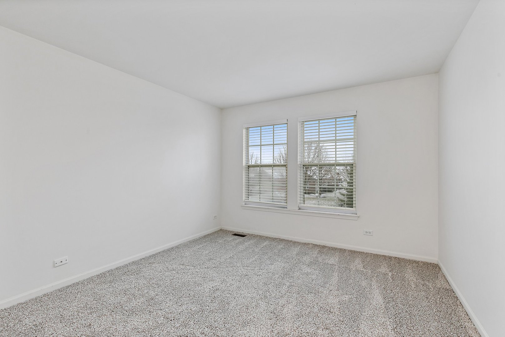 5734 Red Oak Drive Hoffman Estates, IL 60192 - Photo 25 of 31 an empty room with a empty space and windows
