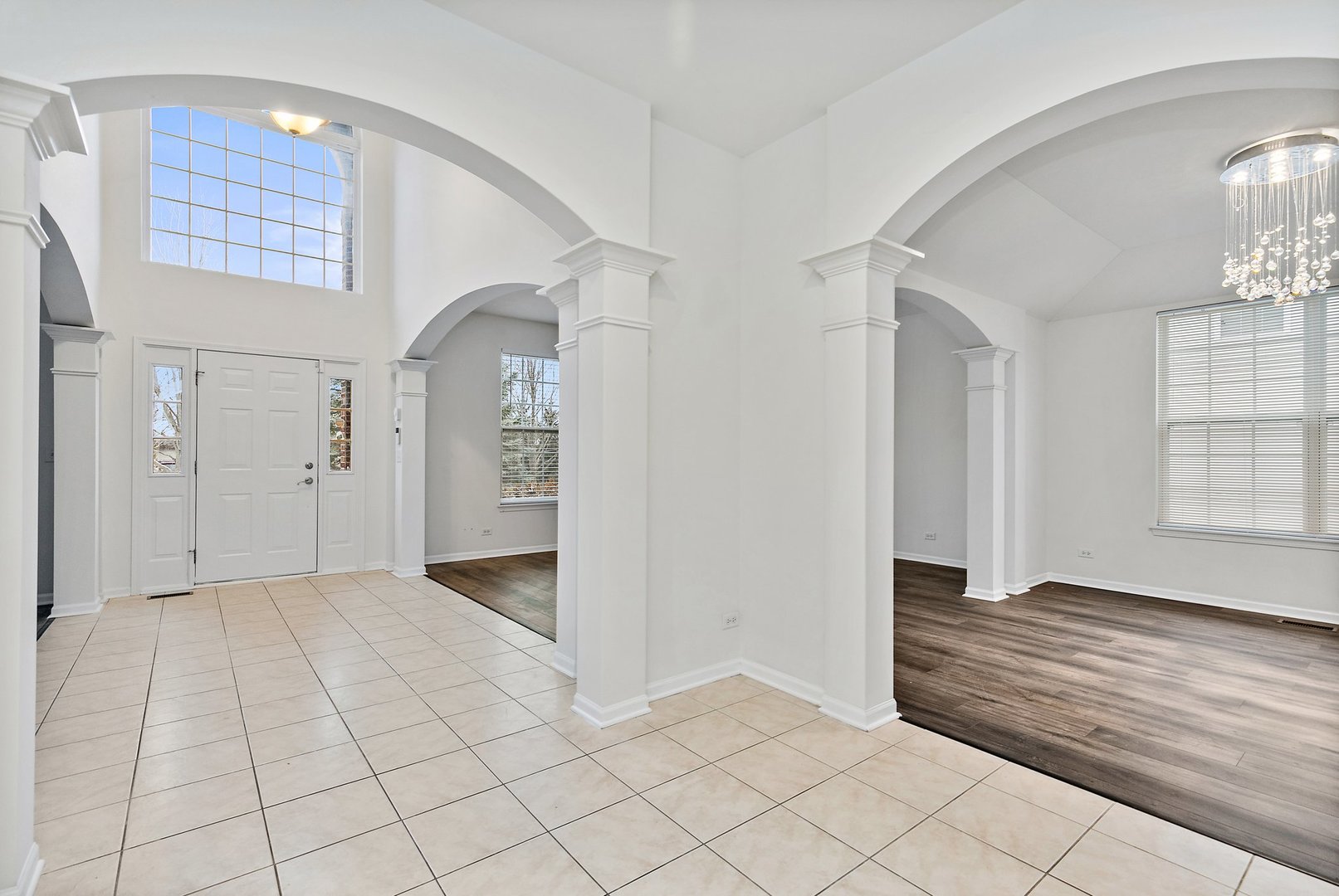 5734 Red Oak Drive Hoffman Estates, IL 60192 - Photo 3 of 31 an empty room with entrance and windows
