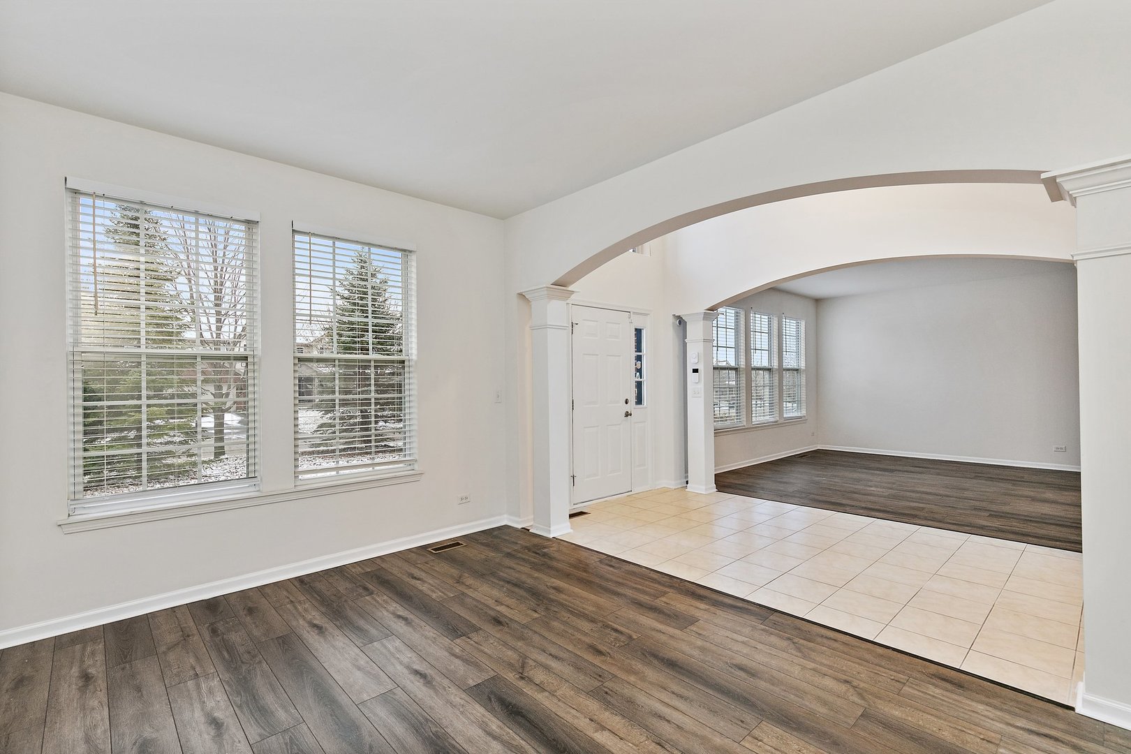 5734 Red Oak Drive Hoffman Estates, IL 60192 - Photo 4 of 31 a view of an empty room with wooden floor and a window