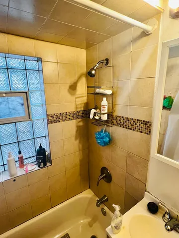 a bathroom with a sink and a shower
