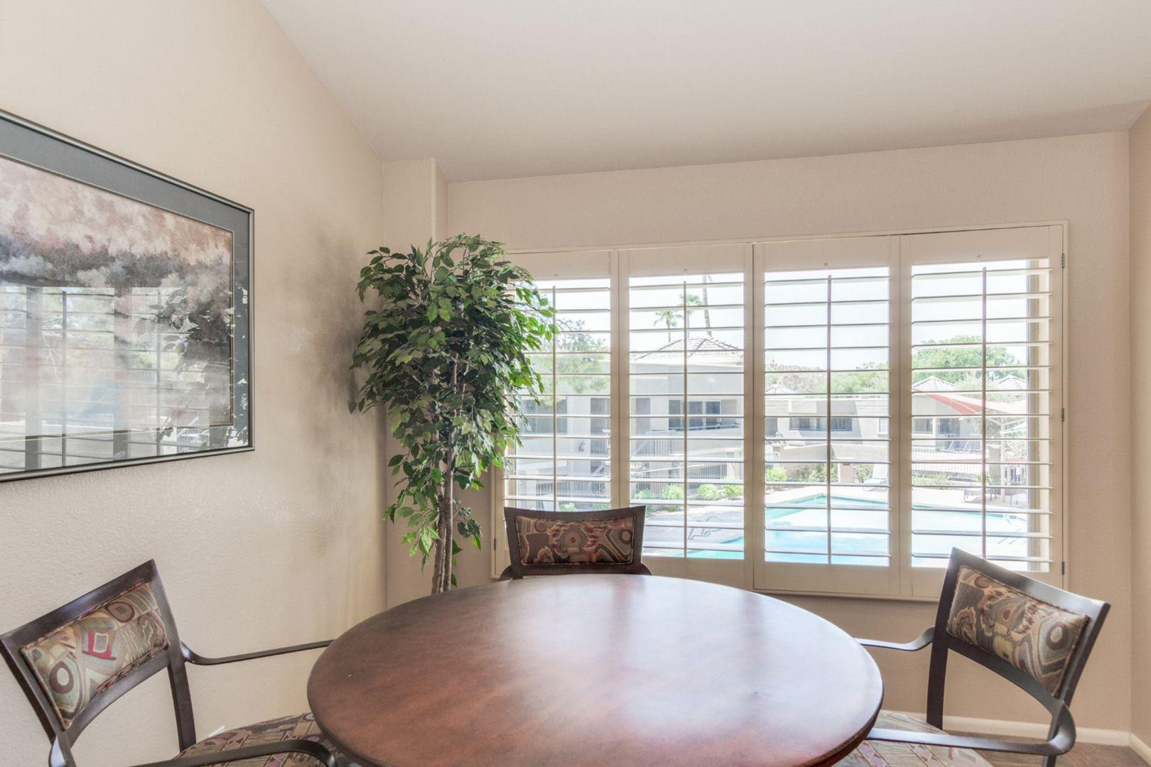 1720 East Thunderbird Road, Unit 1086 Phoenix, AZ 85022 - Photo 23 of 32 a view of a livingroom with furniture window and wooden floor