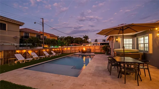 a view of a swimming pool with a patio