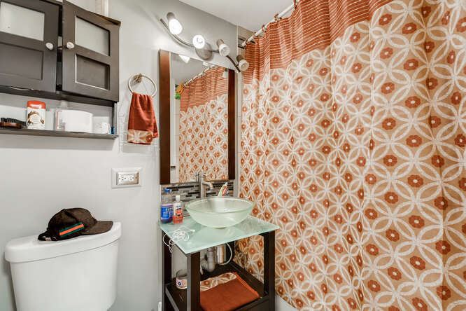 5815 South May Street Chicago, IL 60621 - Photo 23 of 26 a kitchen with stainless steel appliances granite countertop a refrigerator a stove top oven a sink dishwasher and white cabinets