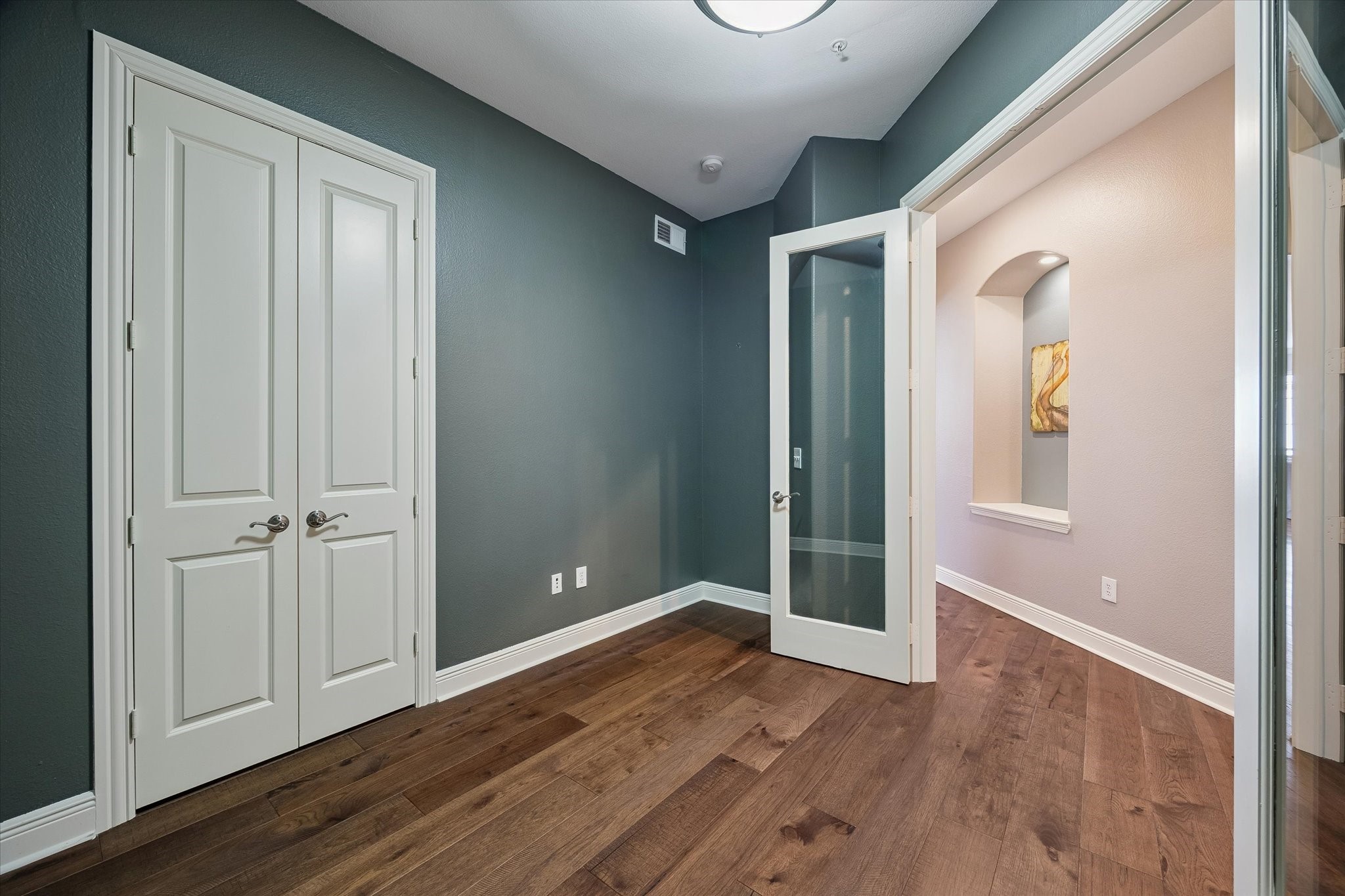 2120 Kipling Street, Unit 304 Houston, TX 77098 - Photo 20 of 24 Behind double doors, the private study offers a quiet and versatile work-from-home space designed for today’s lifestyle. Whether used as a home office, reading room, or flex space, it adds both functionality and flexibility to the home.
