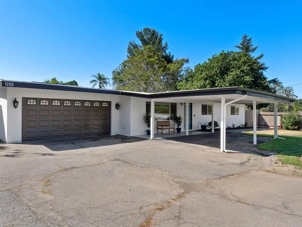 a house view with a garden space