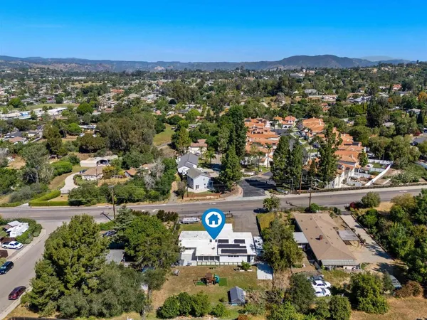 an aerial view of residential houses with outdoor space