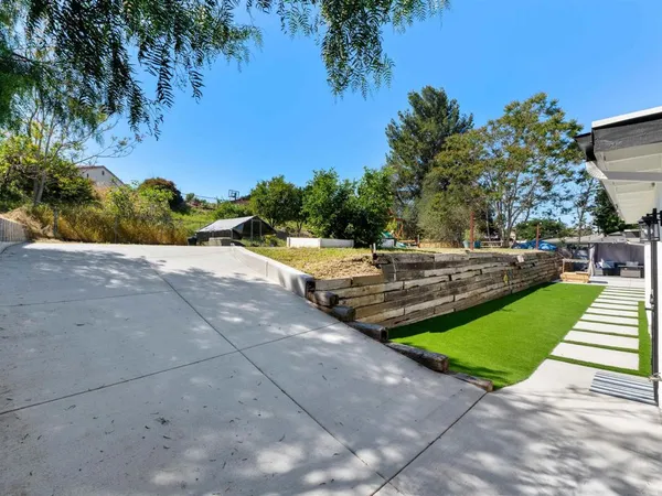 an aerial view of residential house with outdoor space